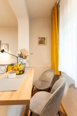 a dining room with two chairs and a table at Our Place in Sofia