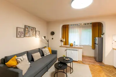 a living room with a couch and a table at Our Place in Sofia