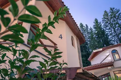 a building with the number four on it at Вила Форте Villa Forte in Pamporovo