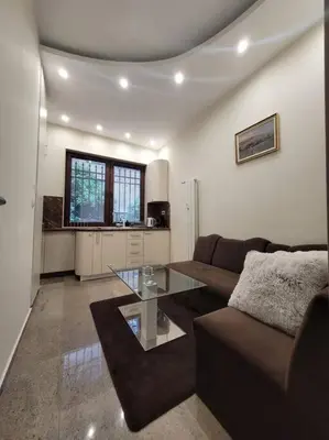 a living room with a couch and a table at Luxury apartment Sofia top centre in Sofia