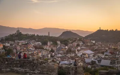 a cityscape of a city at sunset at Urban Exec Suite with Free Gym Pass, Full Office Setup and Designated Parking Space in Plovdiv