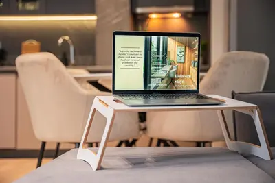 a laptop sitting on a table with chairs at Urban Exec Suite with Free Gym Pass, Full Office Setup and Designated Parking Space in Plovdiv