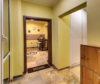 a hallway with a door leading to a bathroom at Comfort & Cozy Apartment in Sofia Center in Sofia