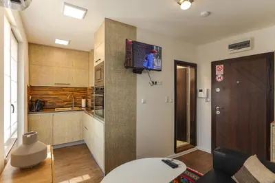 a living room with a television on a wall at Old Town View in Plovdiv