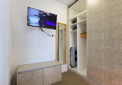 a living room with a tv on a wall at Old Town View in Plovdiv