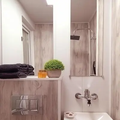 a bathroom with a sink and a toilet and a mirror at Alis in Sofia