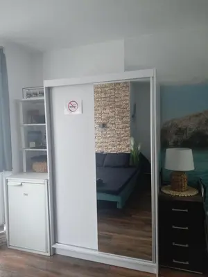 a sliding glass door in a room with a couch at Alis in Sofia