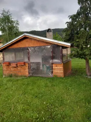 a house with a tarp on it in a field at Къща за гости Дани in Govedartsi