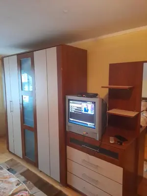 a room with a tv sitting on a dresser at Къща за гости Дани in Govedartsi