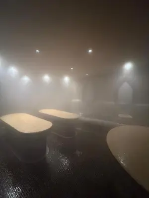 a room with three tables in a room with lights at The Nature View Suite, part of Terra Complex & Spa in Bansko