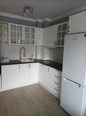 a kitchen with white cabinets and a refrigerator at One Bedroom Apartment 61 - Restaurant Stadium Plovdiv in Plovdiv