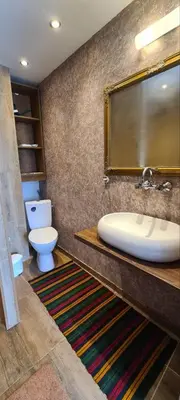 a bathroom with a sink and a toilet at стаи за гости Никол in Starosel