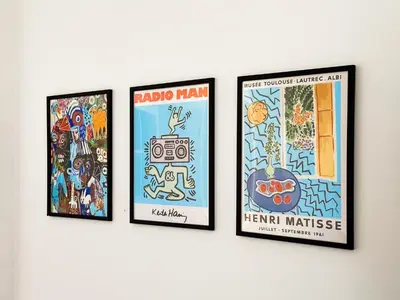 a group of four framed posters on a wall at Budget Stay Near Sofias Lions Bridge in Sofia