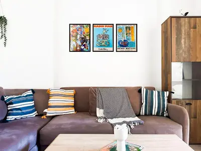 a living room with a brown couch and a table at Budget Stay Near Sofias Lions Bridge in Sofia