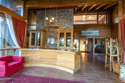 a lobby with a bar in the center of a building at Pirin Golf Hotel&Spa Apartment 42 - private luxury apartment in Razlog