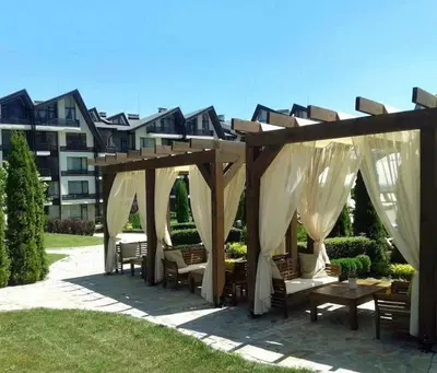a gazebo with chairs and tables in a yard at Family Studio Alex⅋Marry in Razlog