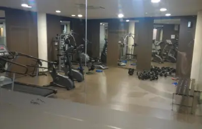 a gym with several treadmills and exercise bikes at Family Studio Alex⅋Marry in Razlog