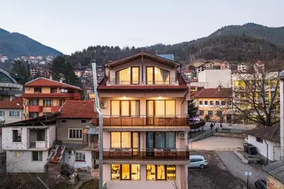 a large building with windows in a city at VALEMO Apart House in Devin