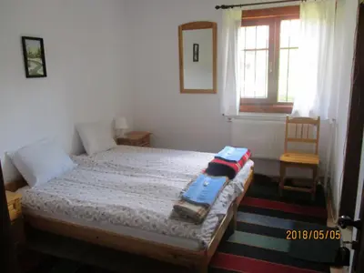 a bedroom with a bed with two towels on it at Borimechkova Kashta in Koprivshtitsa
