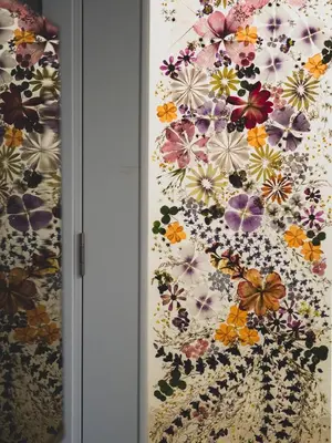 a wall covered in flowers on a wall at Stylish 1BD - Free Private Garage in Plovdiv
