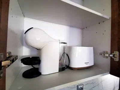 a kitchen with a white appliance on a shelf at Viva 3 Grand monastery in Pamporovo