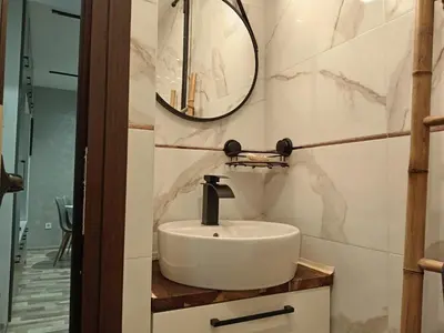 a bathroom with a sink and a mirror at Bijoux Apt in the heart of Sofia in Sofia
