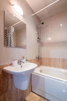 a bathroom with a sink and a bath tub at City Oasis: Stylish Retreat in the Heart of Sofia in Sofia