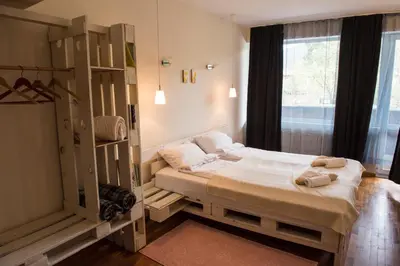 a bedroom with a large bed and a window at Villa 