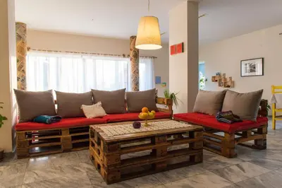a living room with a couch and a table at Villa 