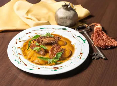 a plate of food on a wooden table at Face Hotel in Sofia