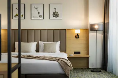 a hotel room with a bed and a table at B1 City Hotel Sofia in Sofia