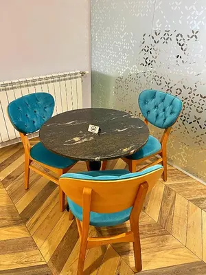 a table with two chairs and a table with a table at Azurro Residence in Sofia