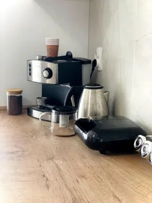 a kitchen with a coffee maker and a blender at Katerina Apartments in Velingrad