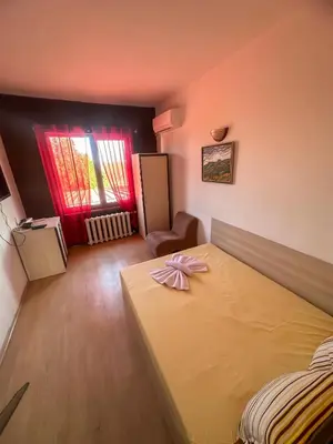 a bedroom with a bed with a bow on it at ТРАКАРТ-ПАРК in Plovdiv