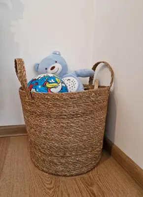 a basket with a teddy bear and other stuffed animals at Pastels - 2BD in Trinity Bansko with underground parking by Flat Mаnager in Bansko
