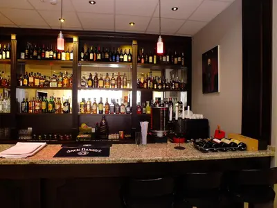 a bar with a lot of bottles of alcohol at Hotel Dragalevtsi in Sofia