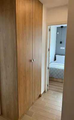 a room with a closet and a bedroom with a bed at Bunaya Sofia in Sofia