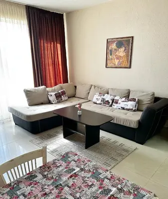 a living room with a couch and a table at Diana’s place in Sandanski