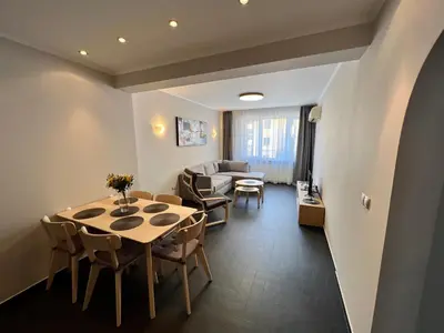 a living room with a table and chairs and a couch at EXCELLENT LOCATION ! General Gurko apartment in Sofia