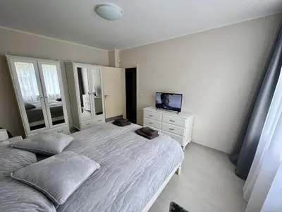 a bedroom with a large bed and a television at EXCELLENT LOCATION ! General Gurko apartment in Sofia