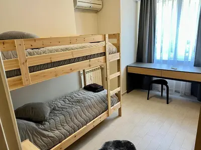 a bedroom with two bunk beds and a desk at EXCELLENT LOCATION ! General Gurko apartment in Sofia