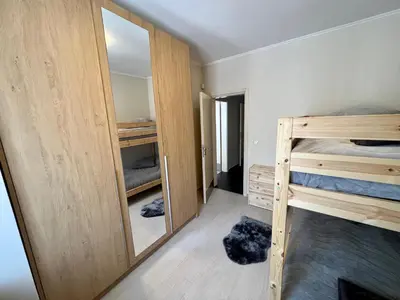 a bedroom with two bunk beds and a mirror at EXCELLENT LOCATION ! General Gurko apartment in Sofia