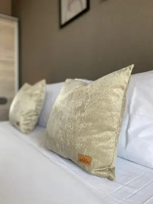a bed with two pillows on top of it at Private Apartment for 4 Guests and Parking in Plovdiv