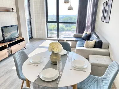 a living room with a white table and chairs at Private Apartment for 4 Guests and Parking in Plovdiv