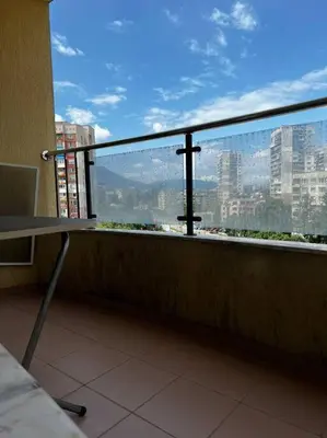 a balcony with a view of a city skyline at Blue & Gold Stylish Apartment in Sofia