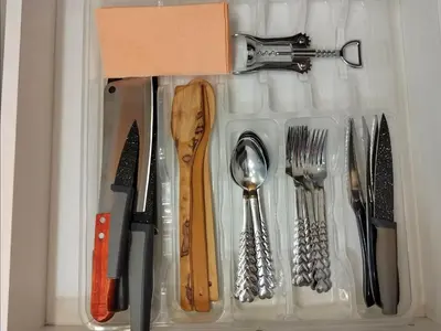a plastic container with utensils in a drawer at Gold Infinity in Velingrad