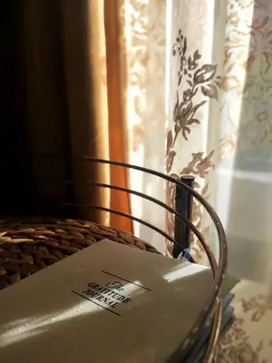 a box sitting on a chair in front of a window at Gold Infinity in Velingrad