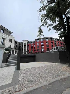 a park in front of a red brick building at 7Mins City Garden and Center+P in Plovdiv