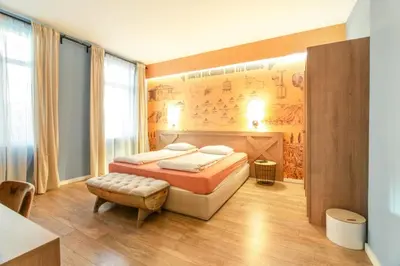 a bedroom with a bed and a wall with a map at 1 BR Wine Journey in Sofia