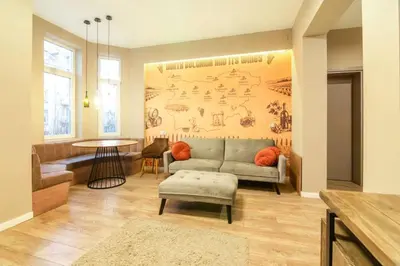 a living room with a couch and a table at 1 BR Wine Journey in Sofia